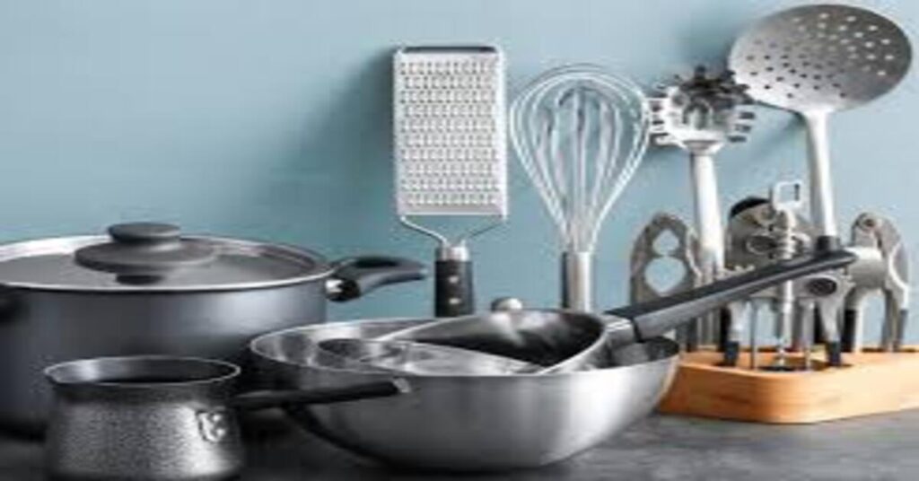 Traditional Indian kitchen utensils like clay pot, cast iron pan, copper vessel and stainless steel cookware arranged for healthy cooking