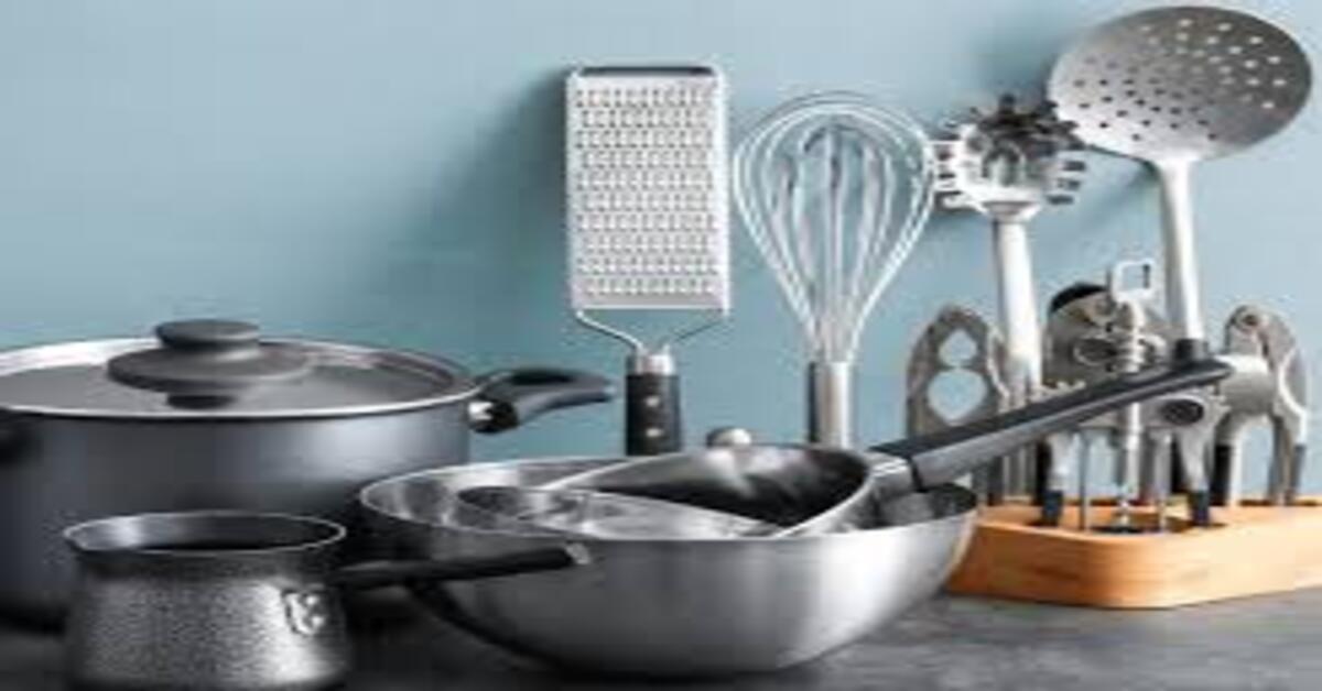 Traditional Indian kitchen utensils like clay pot, cast iron pan, copper vessel and stainless steel cookware arranged for healthy cooking