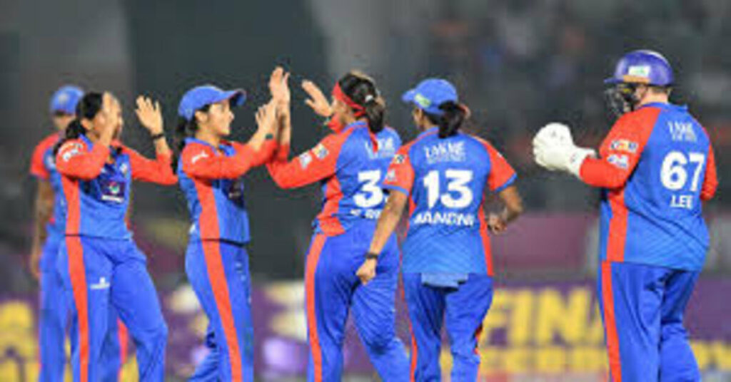 Delhi Capitals women players celebrating victory against Gujarat Giants in WPL eliminator match