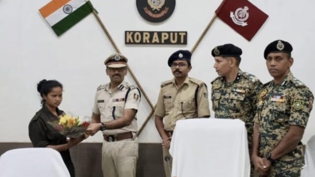 Woman Maoist surrendering before police as Koraput district is declared Naxal free in Odisha